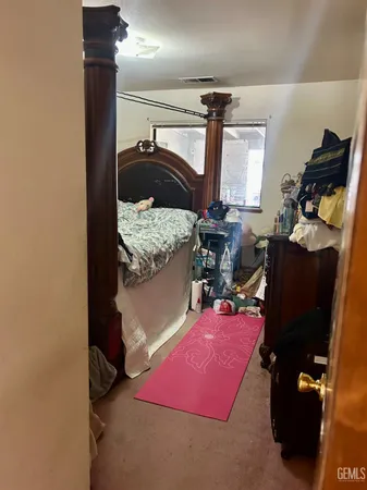 a bed room with a bed and a window