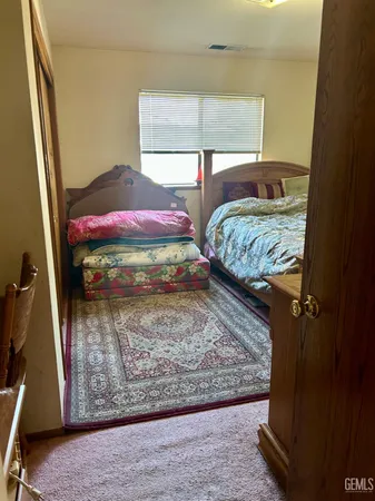 a living room with a couch and a dresser