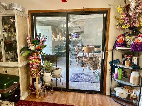 a living room filled with furniture and a potted plant