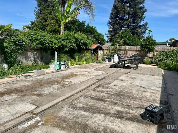 a view of a backyard with a patio