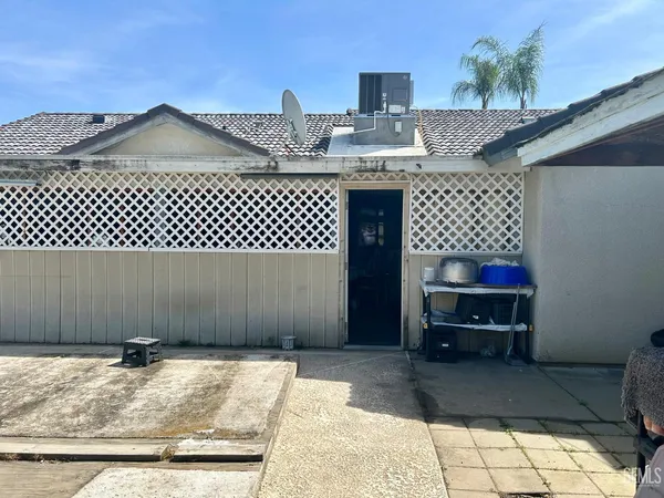 a spacious bathroom with a granite countertop sink and a mirror