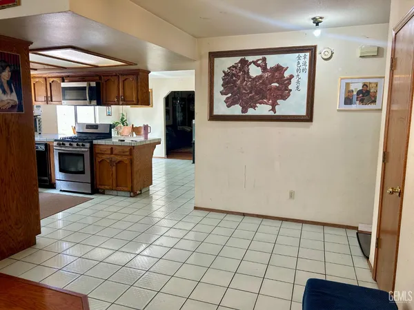 a view of kitchen with furniture and wooden floor