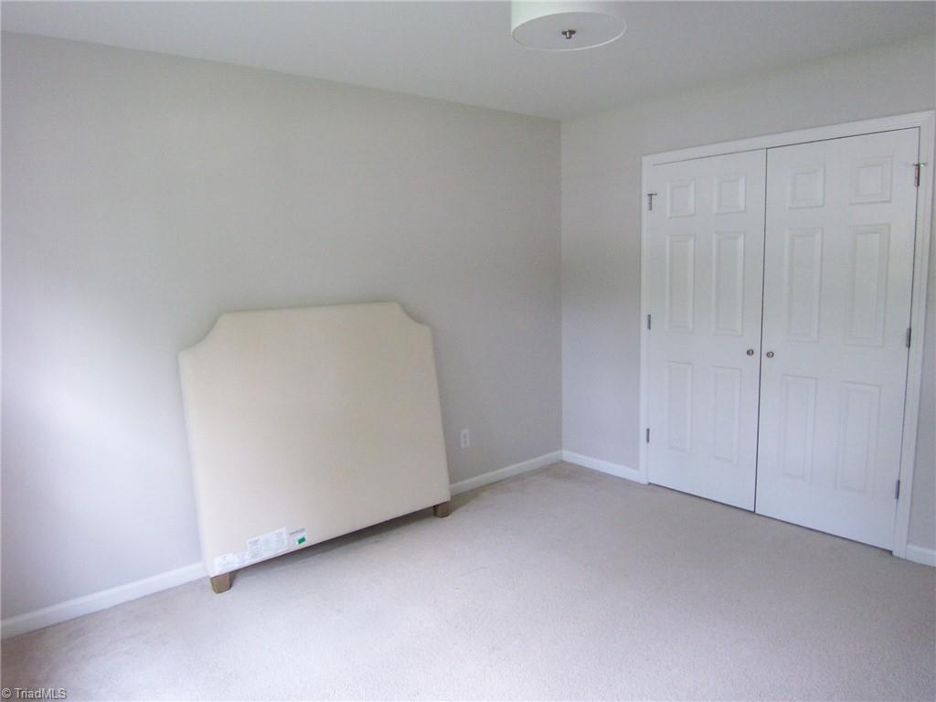 4702 Ridgefall Road Greensboro, NC 27410 - Photo 19 of 27 large double window brightens the space in the bonus room. What a wonderful place for a movie theater, play room or crafts!