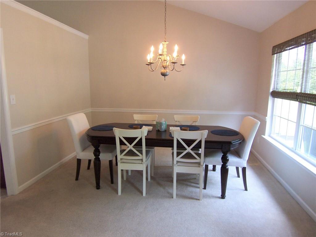 4702 Ridgefall Road Greensboro, NC 27410 - Photo 4 of 27 Gorgeous angles to the ceiling in dining room.