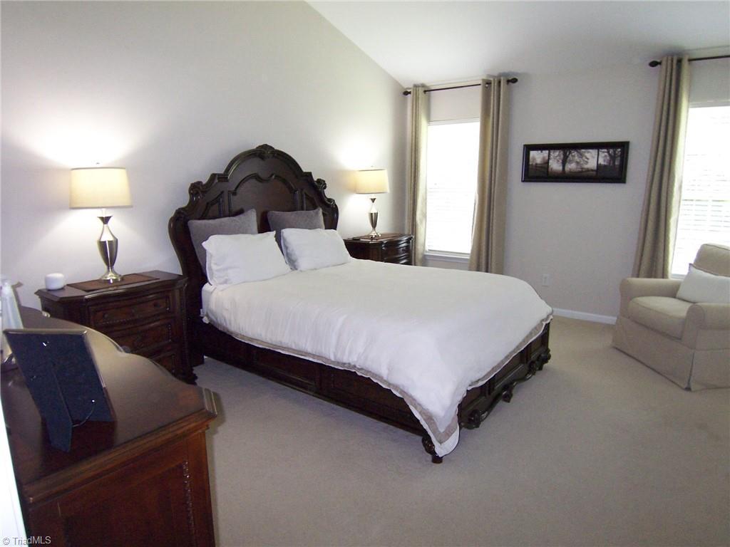 4702 Ridgefall Road Greensboro, NC 27410 - Photo 8 of 27 The primary bedroom is large enough to accommodate any sized furniture. Everything throughout the house is neutral color for easy transition.