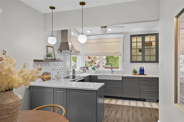 a kitchen with a sink cabinets and window