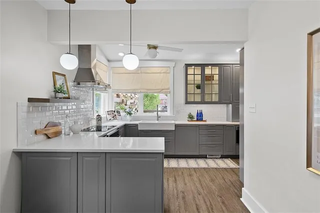 a kitchen with a stove a sink and a refrigerator