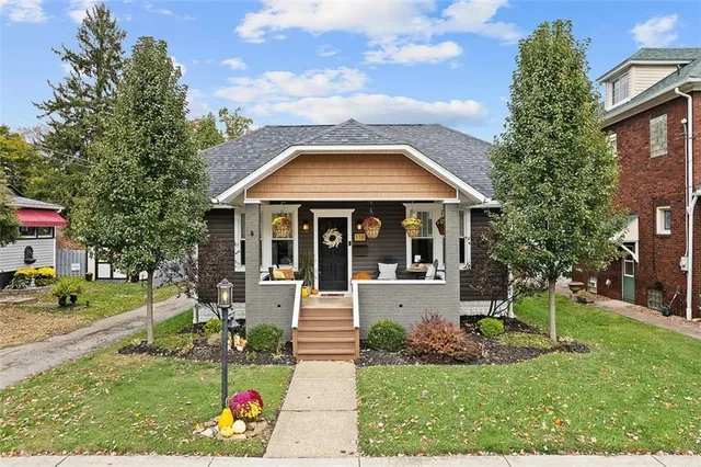 front view of a house with a yard