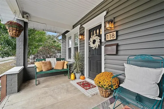a outdoor living space with patio furniture and potted plants