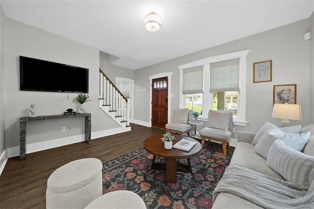 a living room with furniture and a flat screen tv