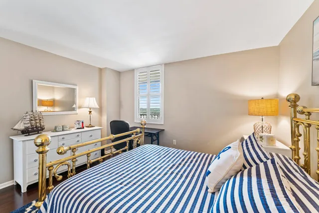 a spacious bathroom with a double vanity sink and a large mirror