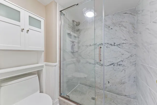 a view of a balcony next to a yard