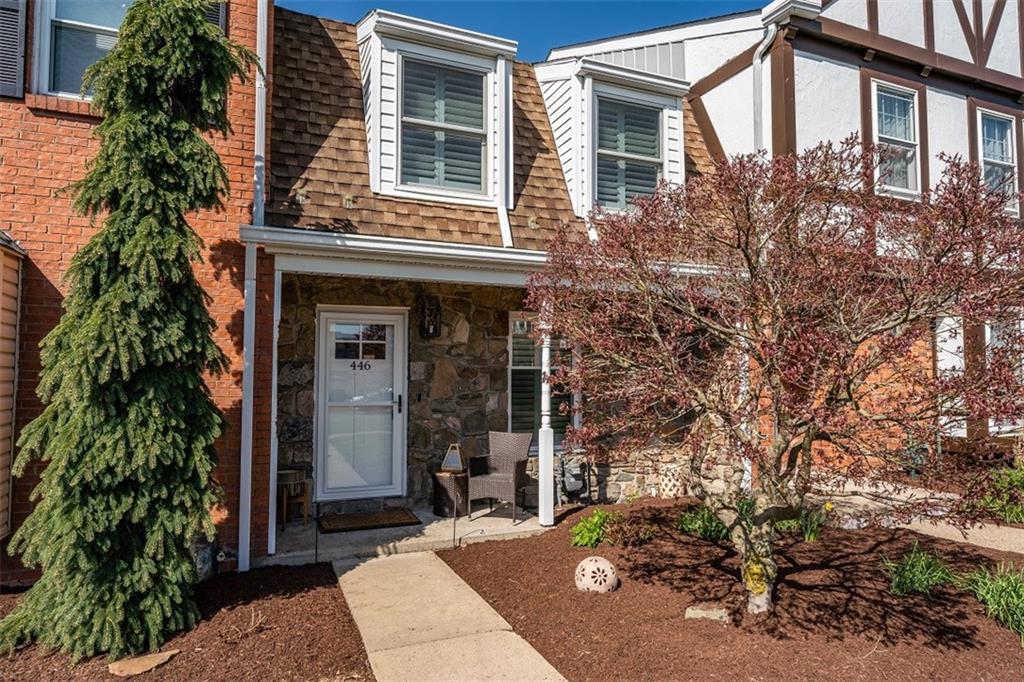 a front view of a house with garden