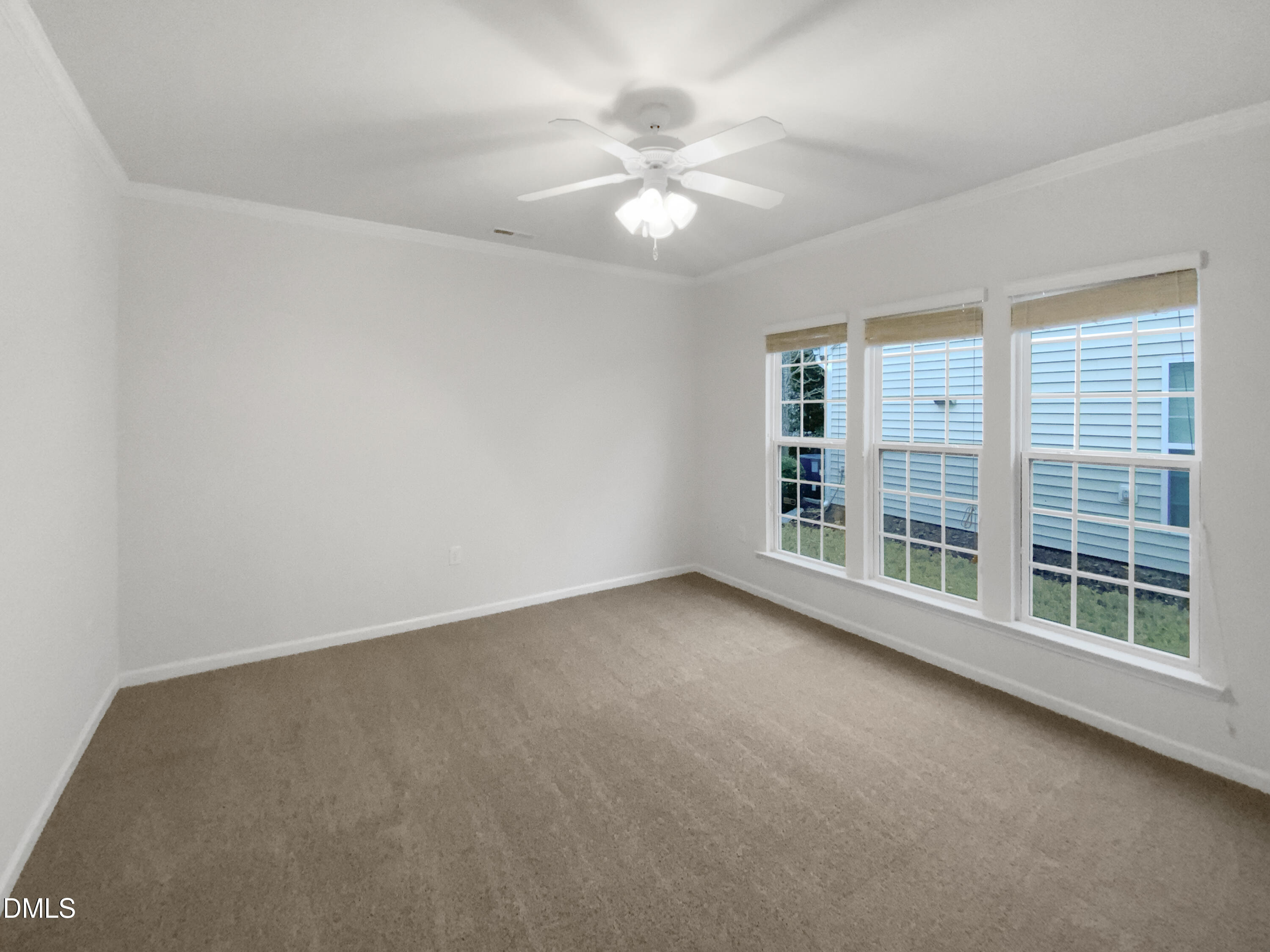 540 Tomkins Loop Cary, NC 27519 - Photo 11 of 19 a view of an empty room with a window