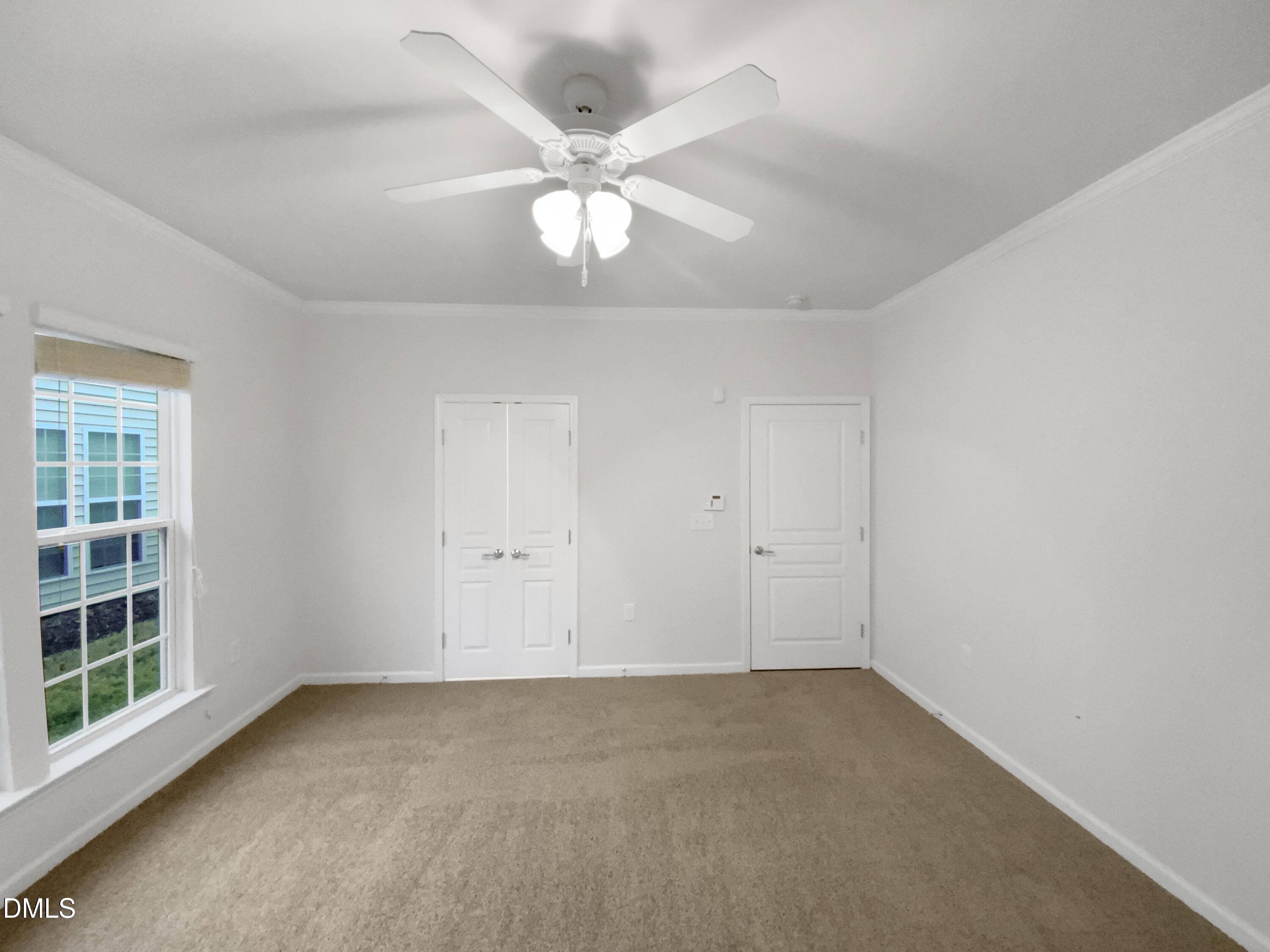 540 Tomkins Loop Cary, NC 27519 - Photo 12 of 19 an empty room with windows and fan