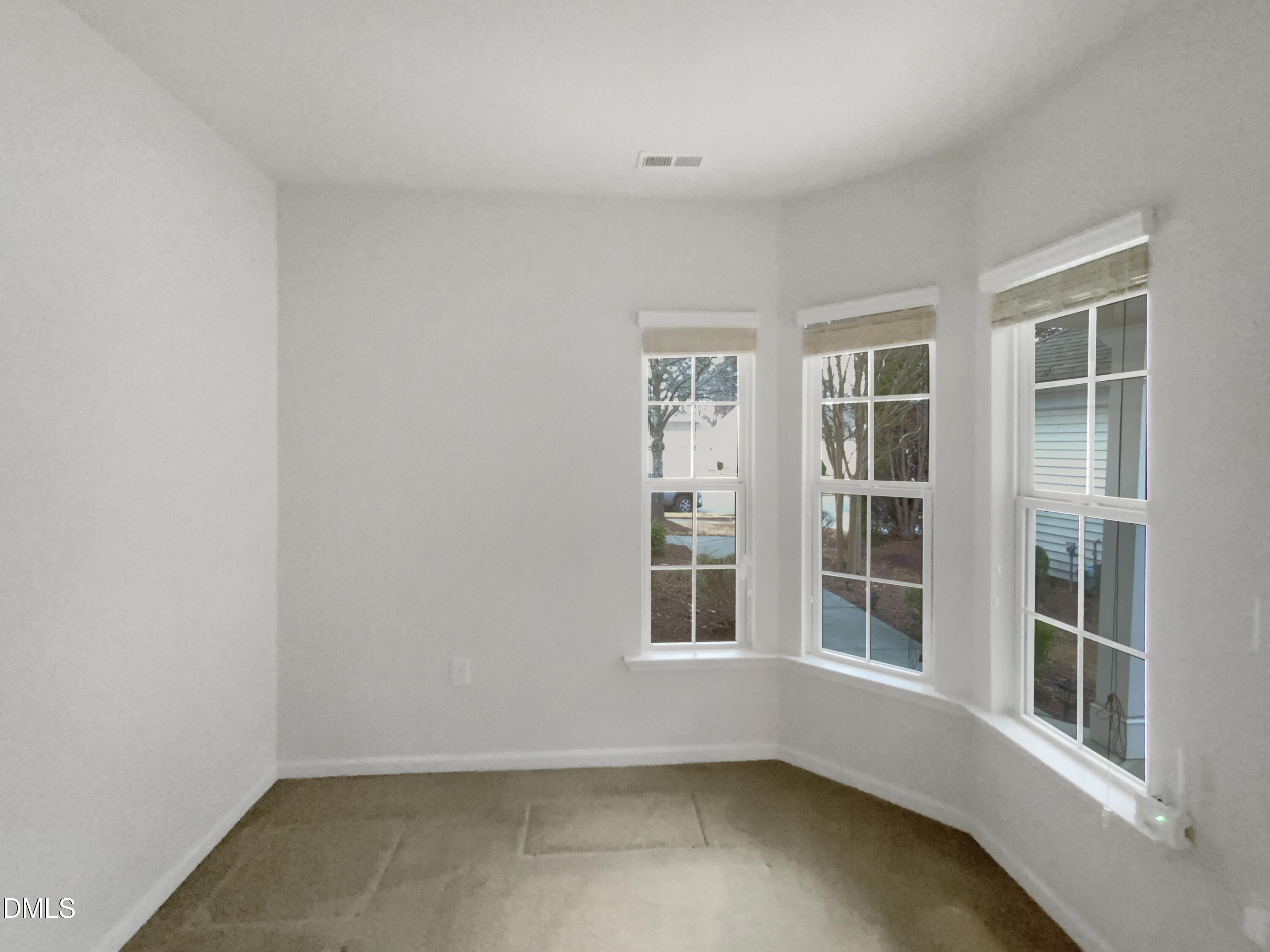 540 Tomkins Loop Cary, NC 27519 - Photo 13 of 19 an empty room with windows