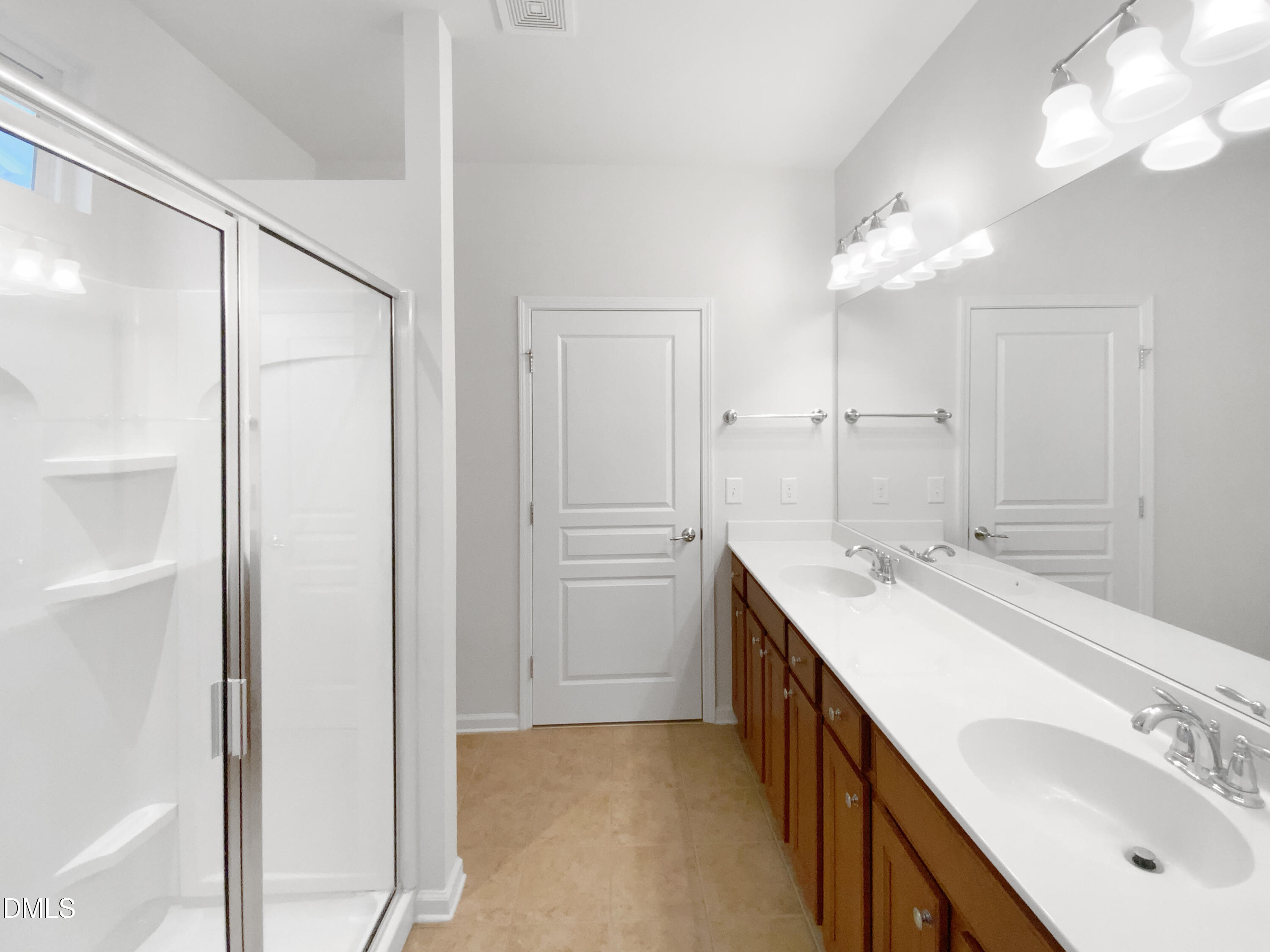 540 Tomkins Loop Cary, NC 27519 - Photo 15 of 19 a bathroom with a double vanity sink mirror and shower