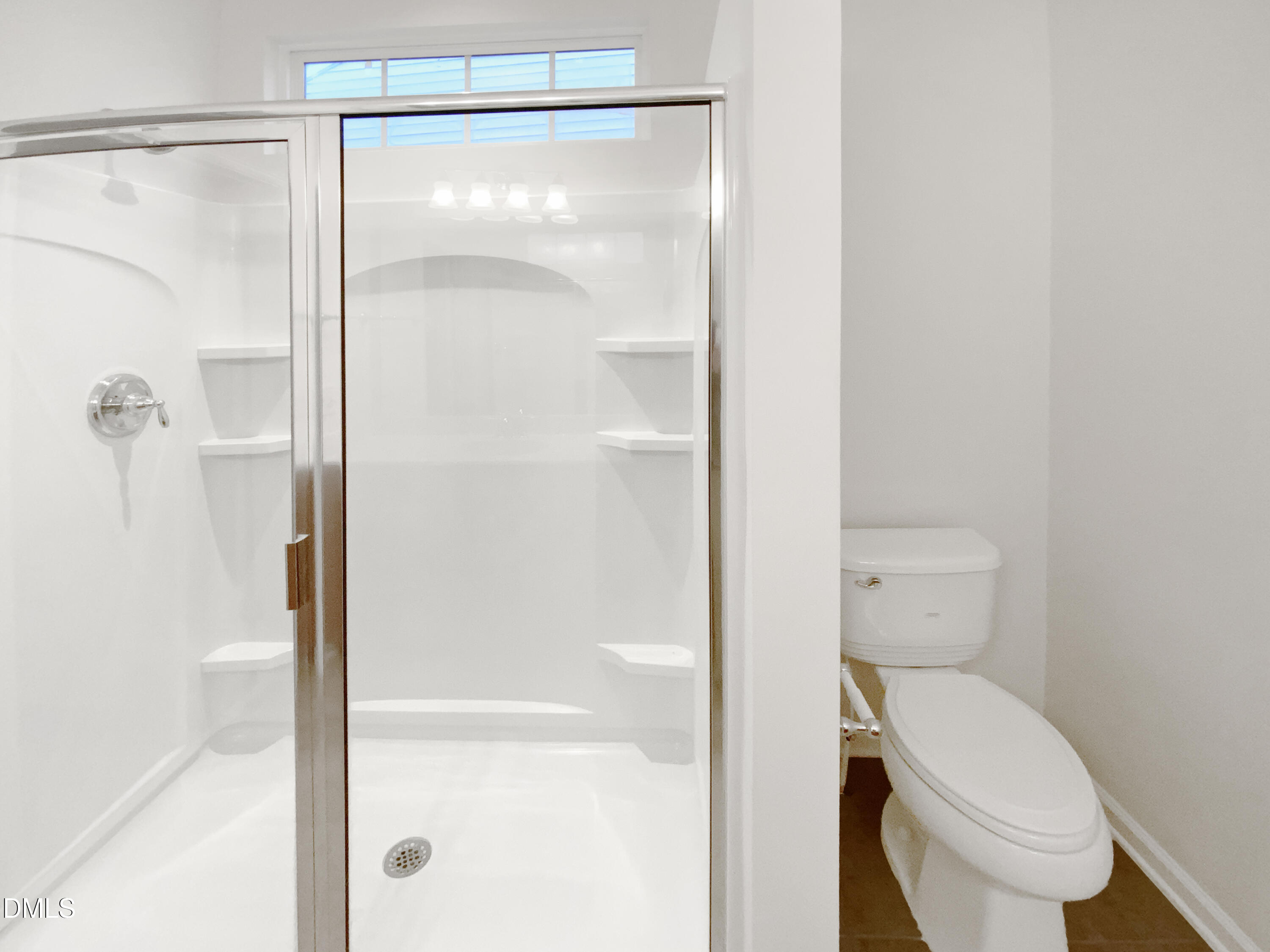 540 Tomkins Loop Cary, NC 27519 - Photo 16 of 19 a bathroom with a toilet and a shower