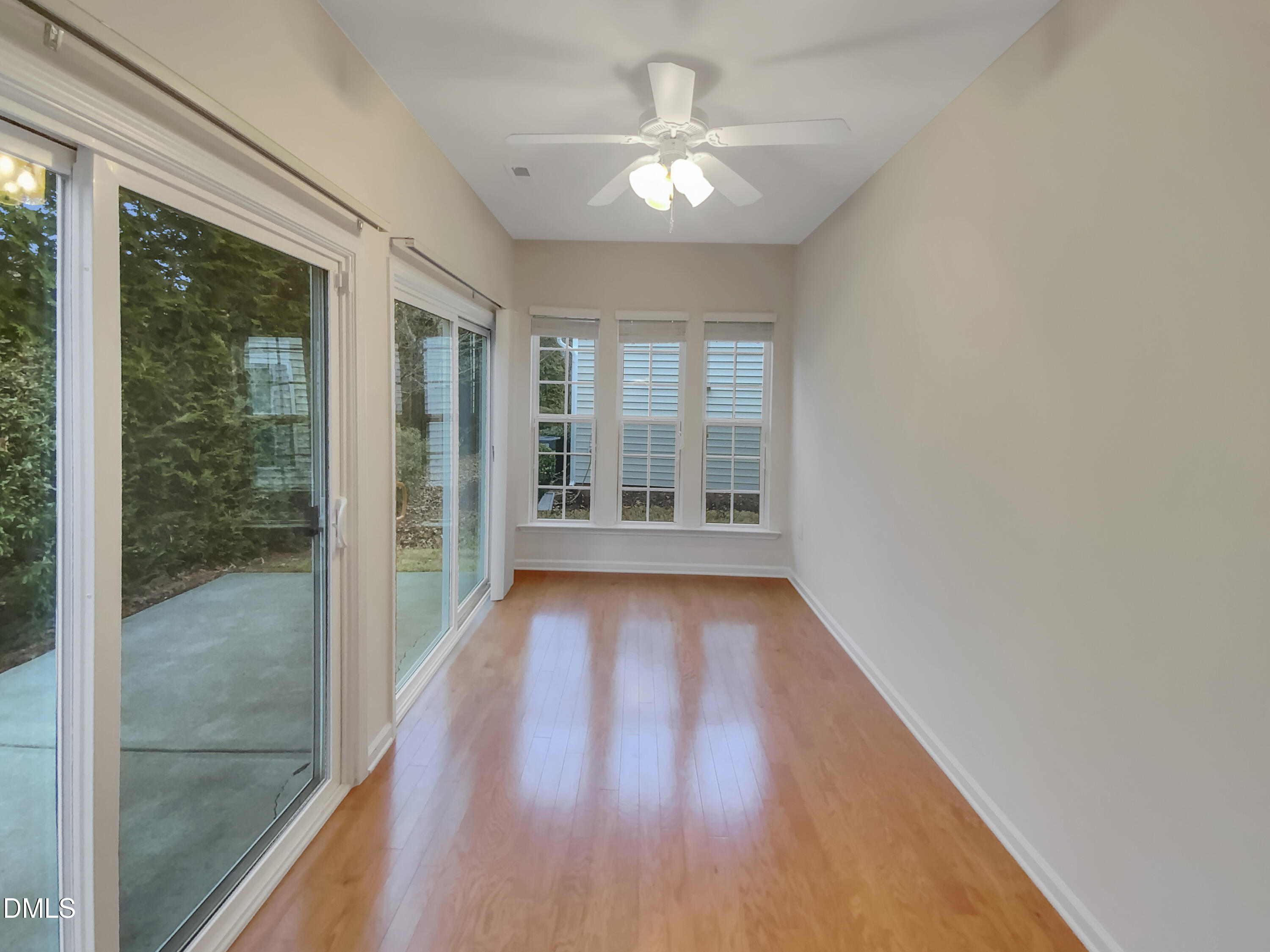 540 Tomkins Loop Cary, NC 27519 - Photo 8 of 19 a view of hallway with wooden floor and fan