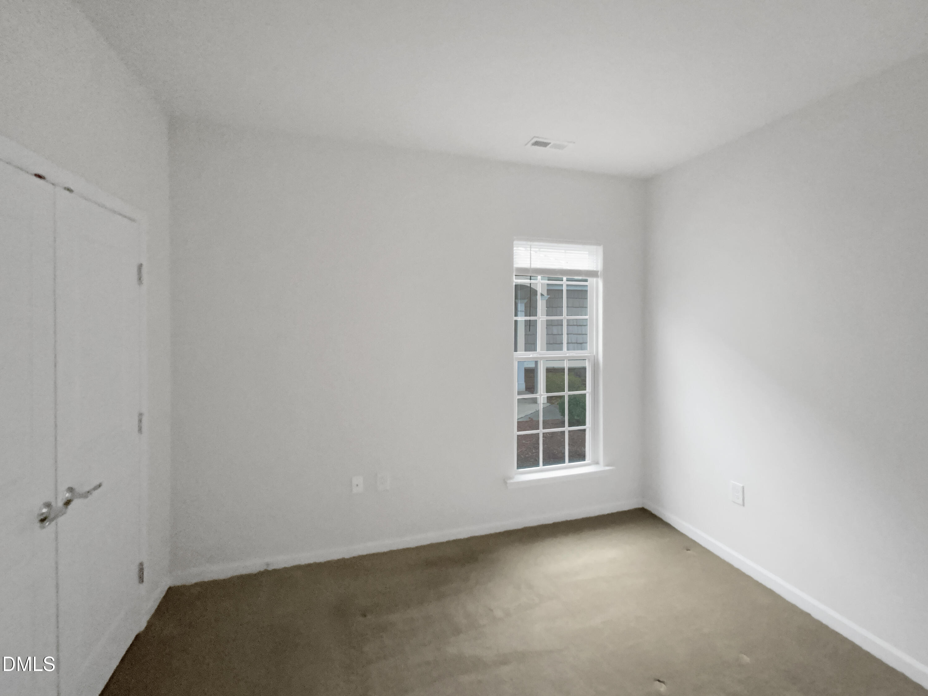 540 Tomkins Loop Cary, NC 27519 - Photo 9 of 19 a view of an empty room with a window