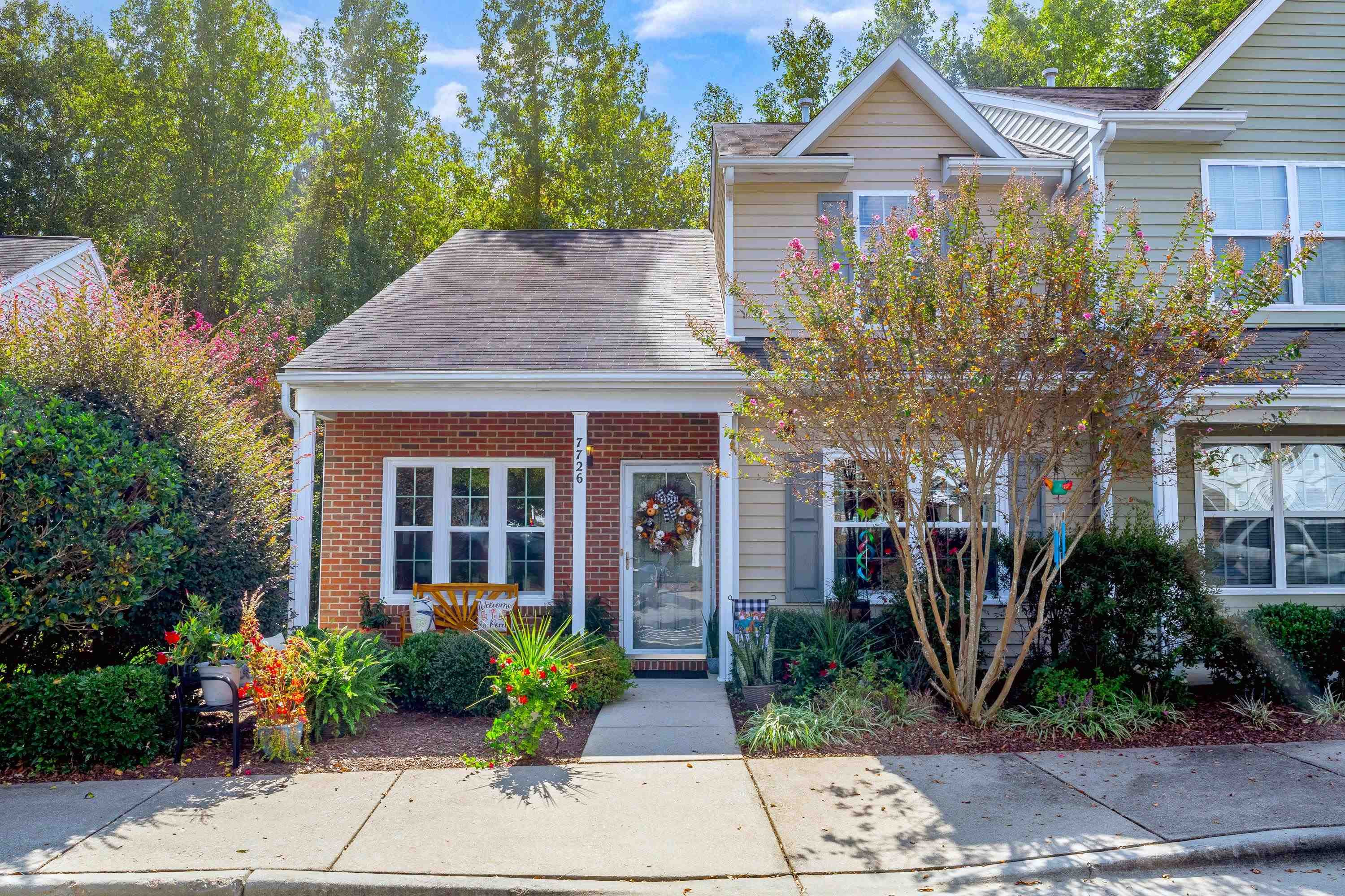 7726 Averette Field Drive Raleigh, NC 27616 - Photo 1 of 29 a front view of a house with garden