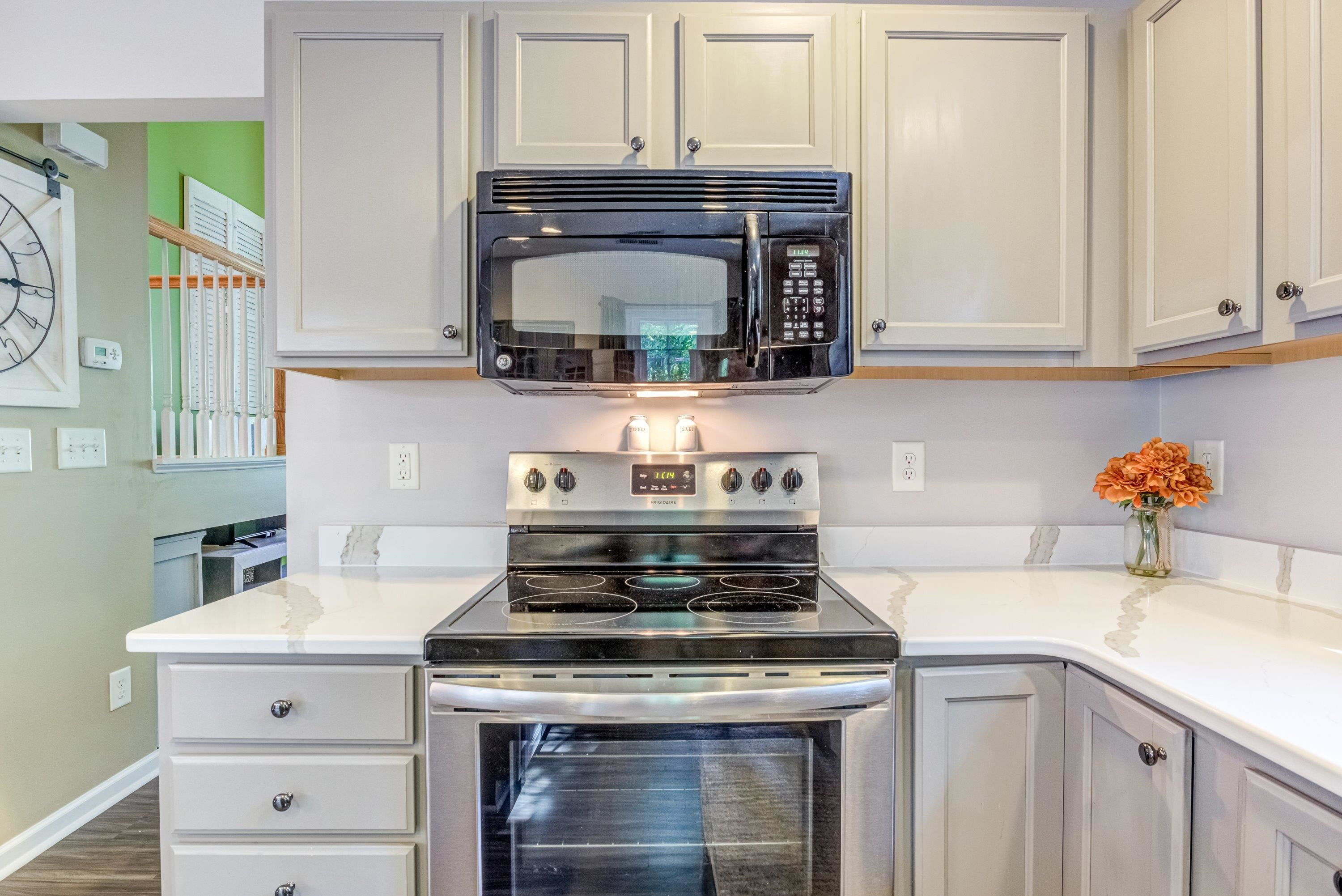 7726 Averette Field Drive Raleigh, NC 27616 - Photo 12 of 29 a stove top oven sitting inside of a kitchen