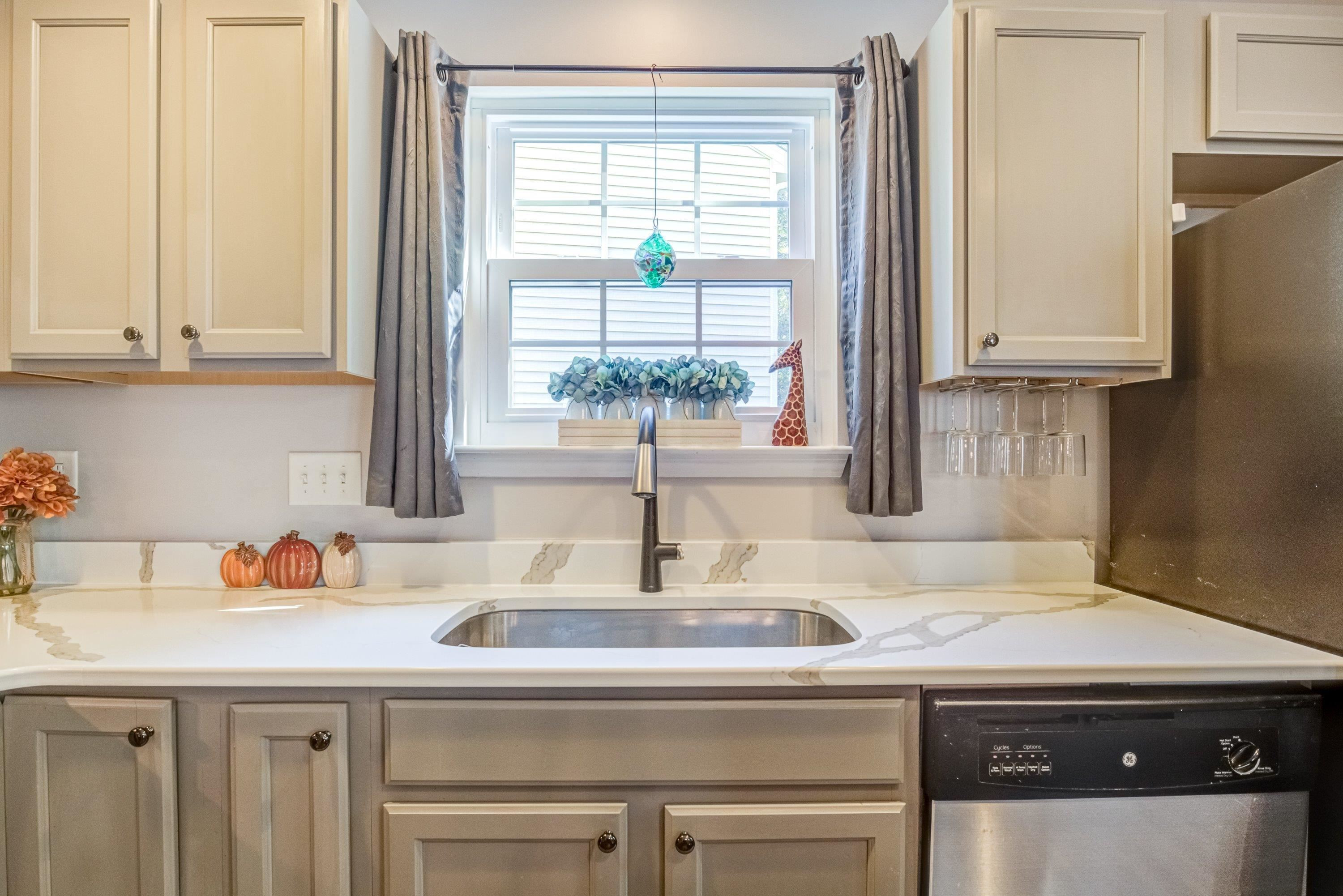 7726 Averette Field Drive Raleigh, NC 27616 - Photo 13 of 29 a kitchen with a sink and a window