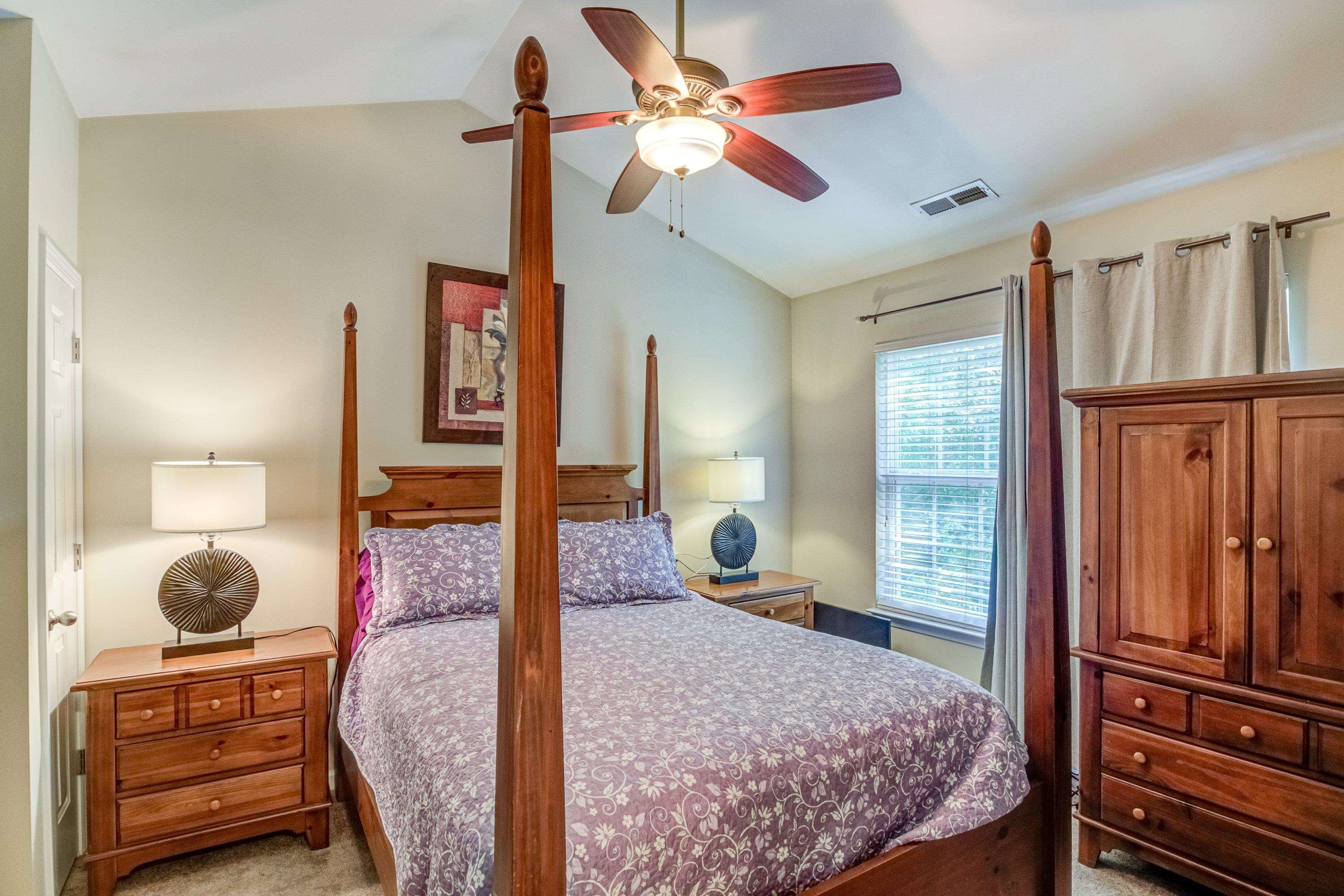 7726 Averette Field Drive Raleigh, NC 27616 - Photo 20 of 29 a bedroom with a bed a dresser and flat screen tv