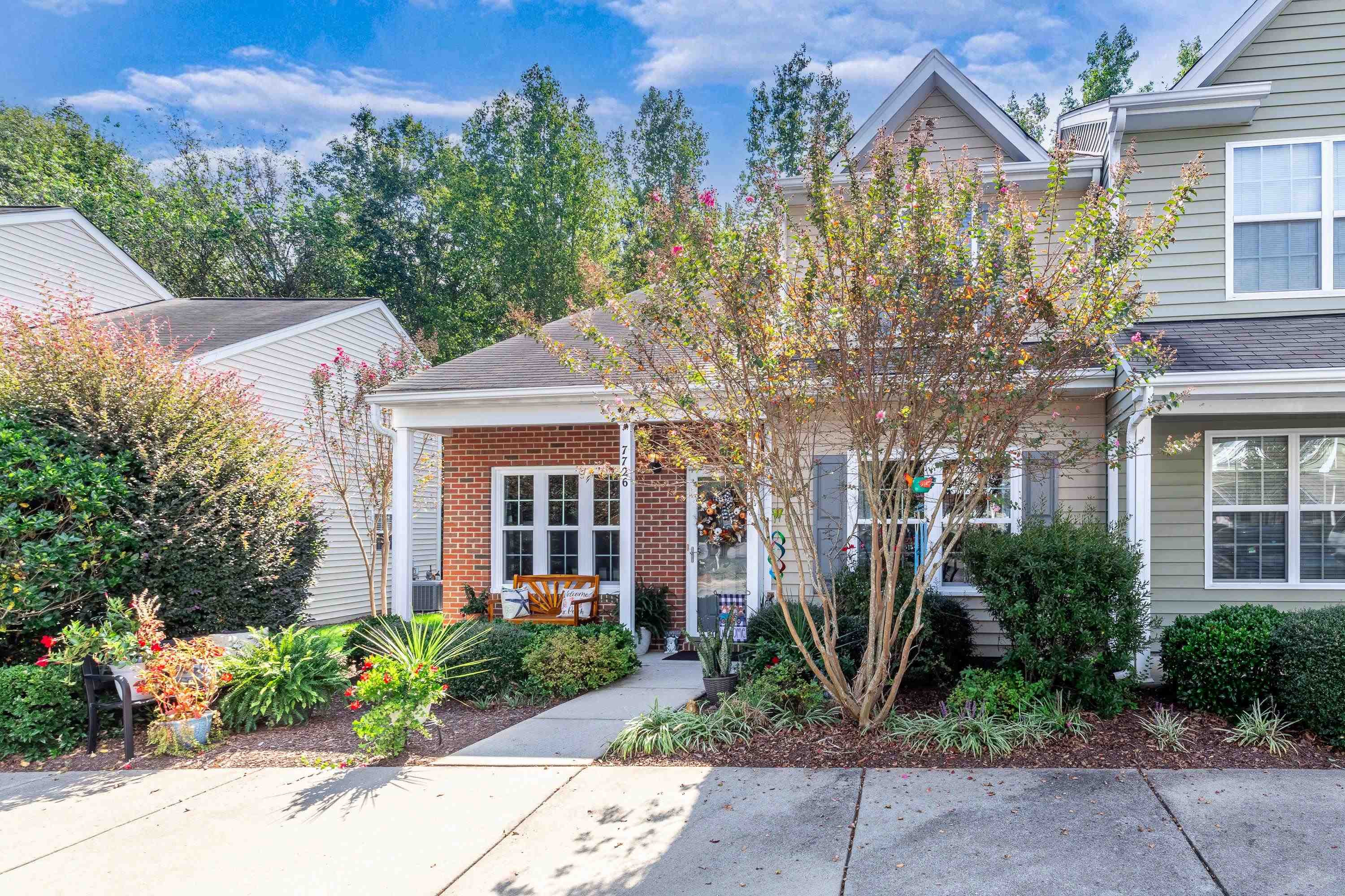 7726 Averette Field Drive Raleigh, NC 27616 - Photo 2 of 29 front view of a house with a garden