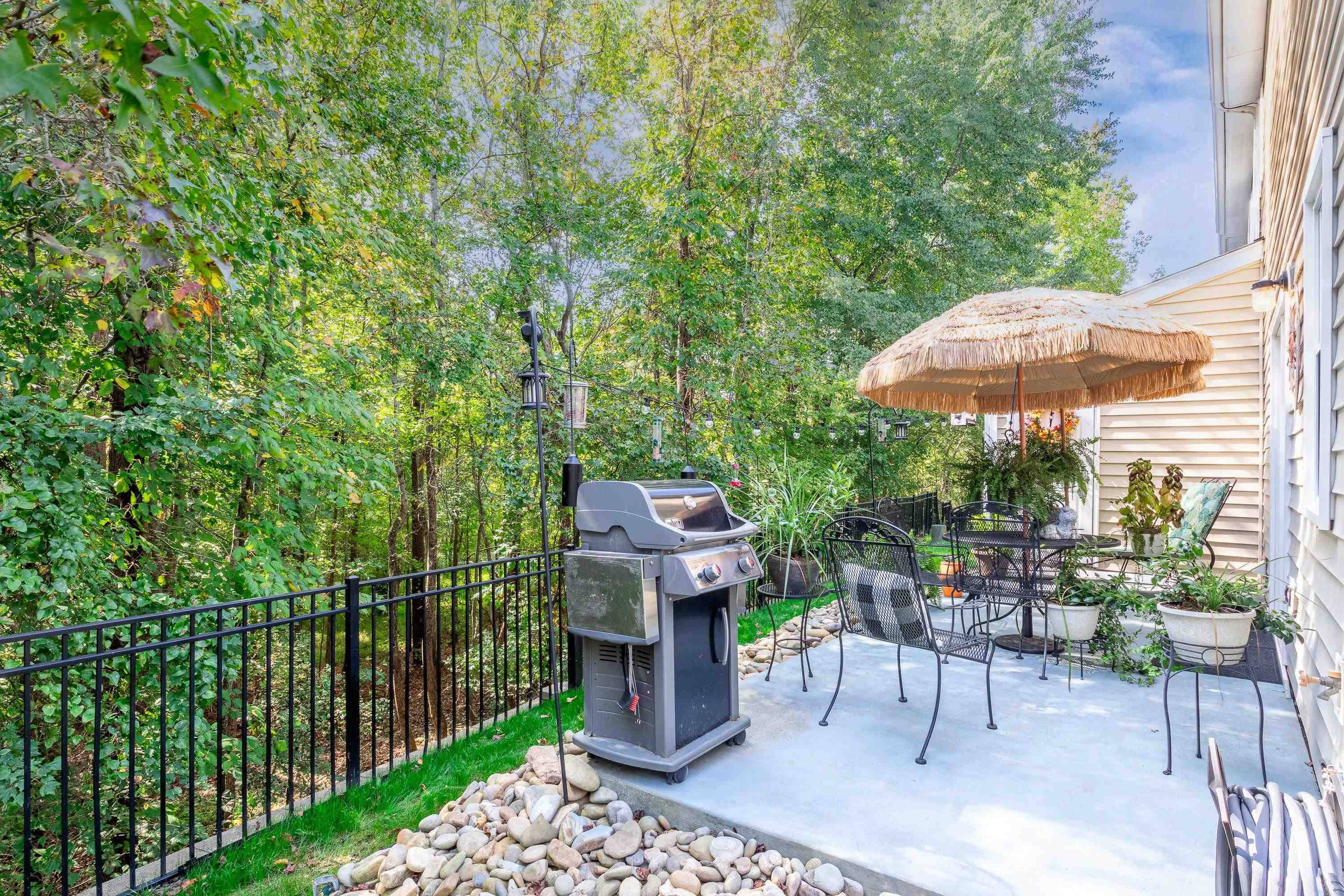 7726 Averette Field Drive Raleigh, NC 27616 - Photo 27 of 29 a view of a chairs and table in backyard