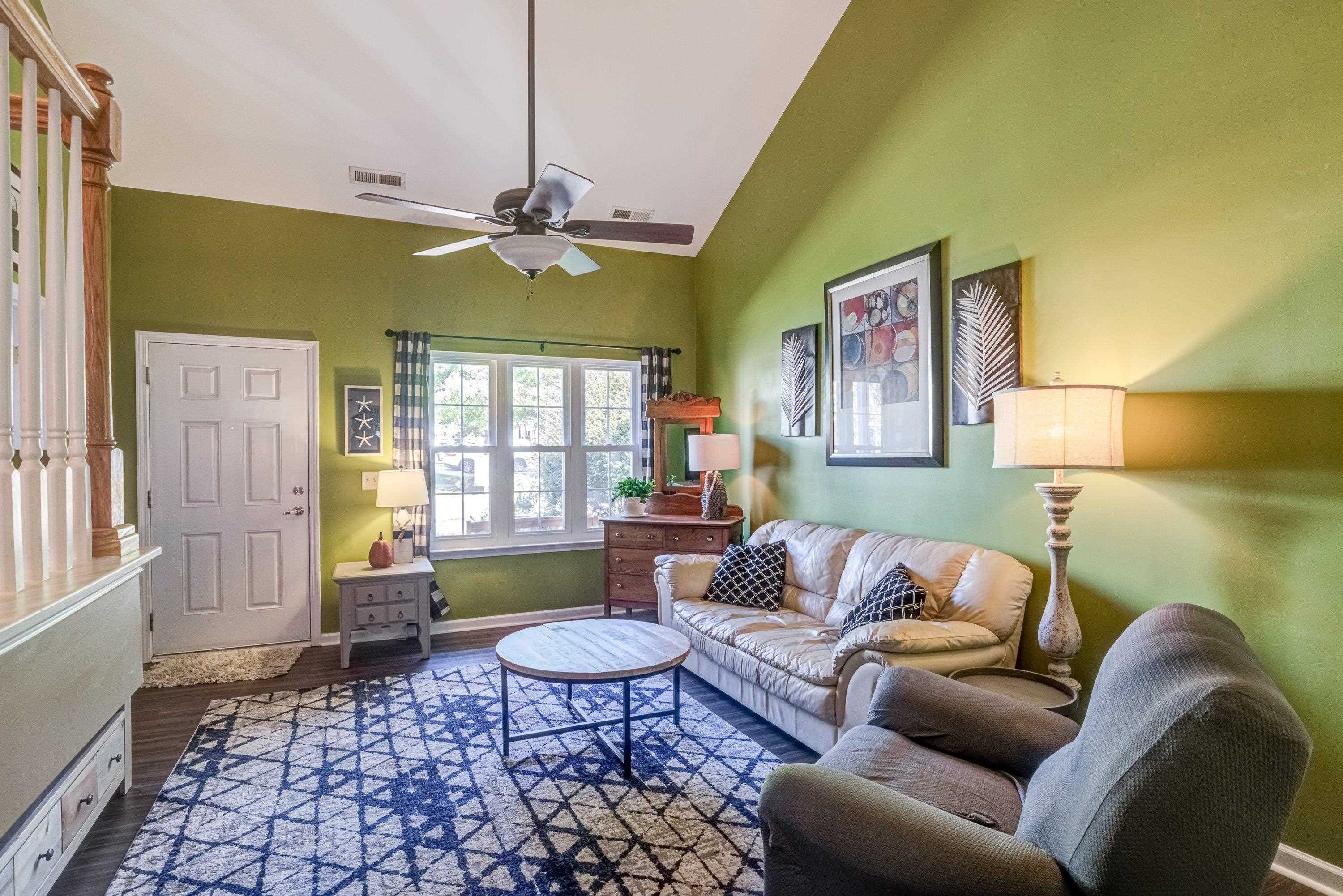 7726 Averette Field Drive Raleigh, NC 27616 - Photo 6 of 29 a living room with furniture and a table