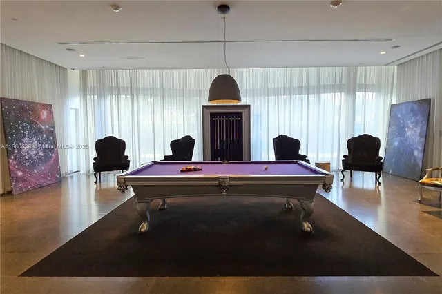 a front view of a building with a garden