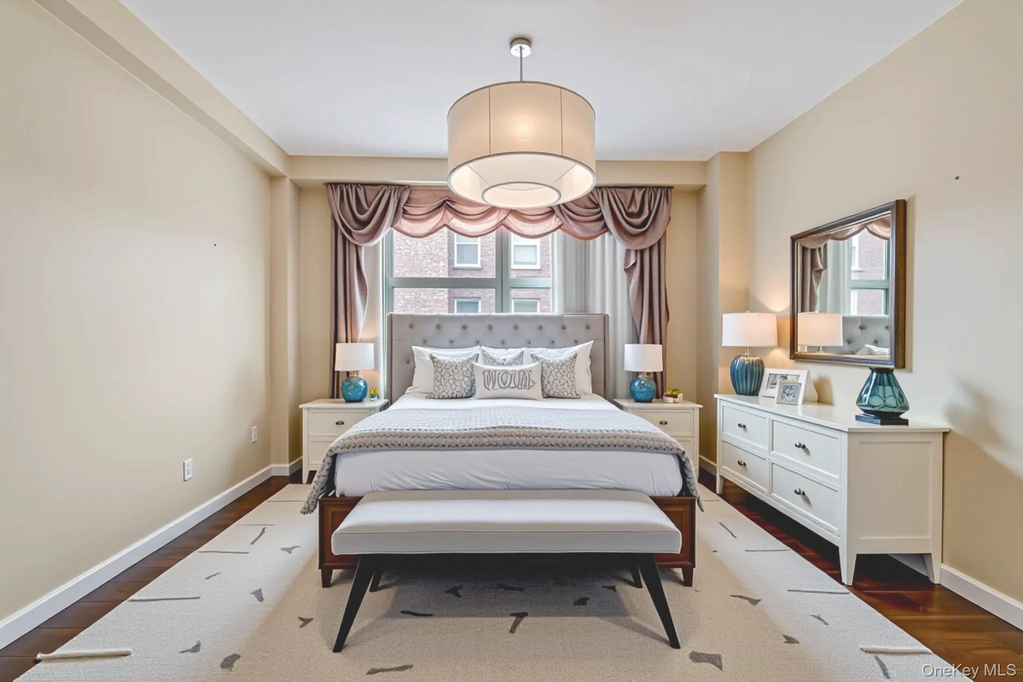 61-15 97th Street, Unit 12H Queens, NY 11374 - Photo 13 of 23 Bedroom with dark wood finished floors and baseboards