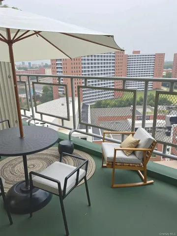 a view of a kitchen with furniture and a window