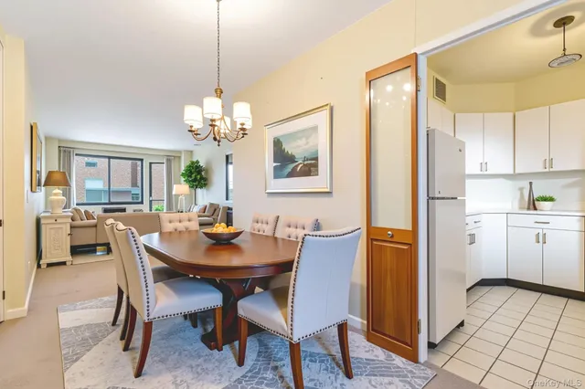 a living room with furniture and a window with balcony view
