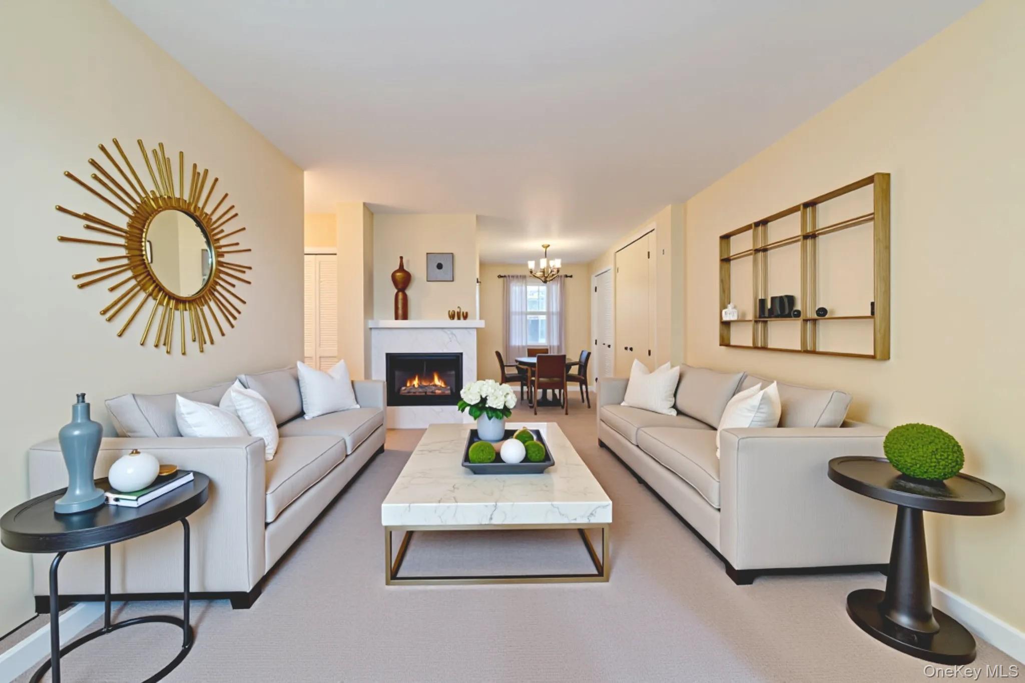 61-15 97th Street, Unit 12H Queens, NY 11374 - Photo 8 of 23 Living room featuring a chandelier and a glass covered fireplace