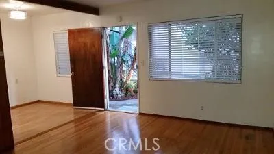 a kitchen with sink a stove and a refrigerator