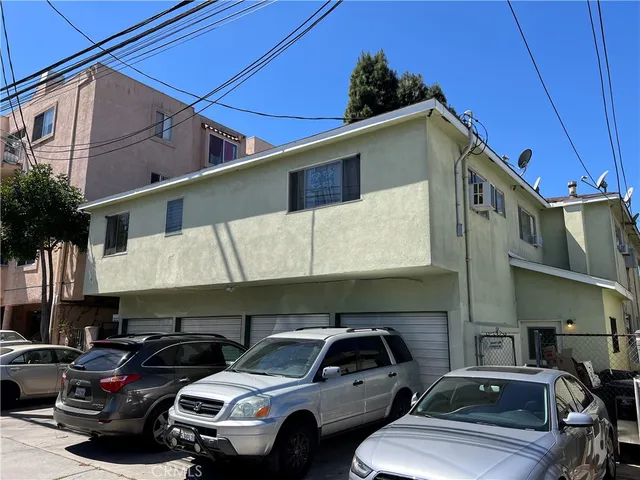 a view of a building with a yard