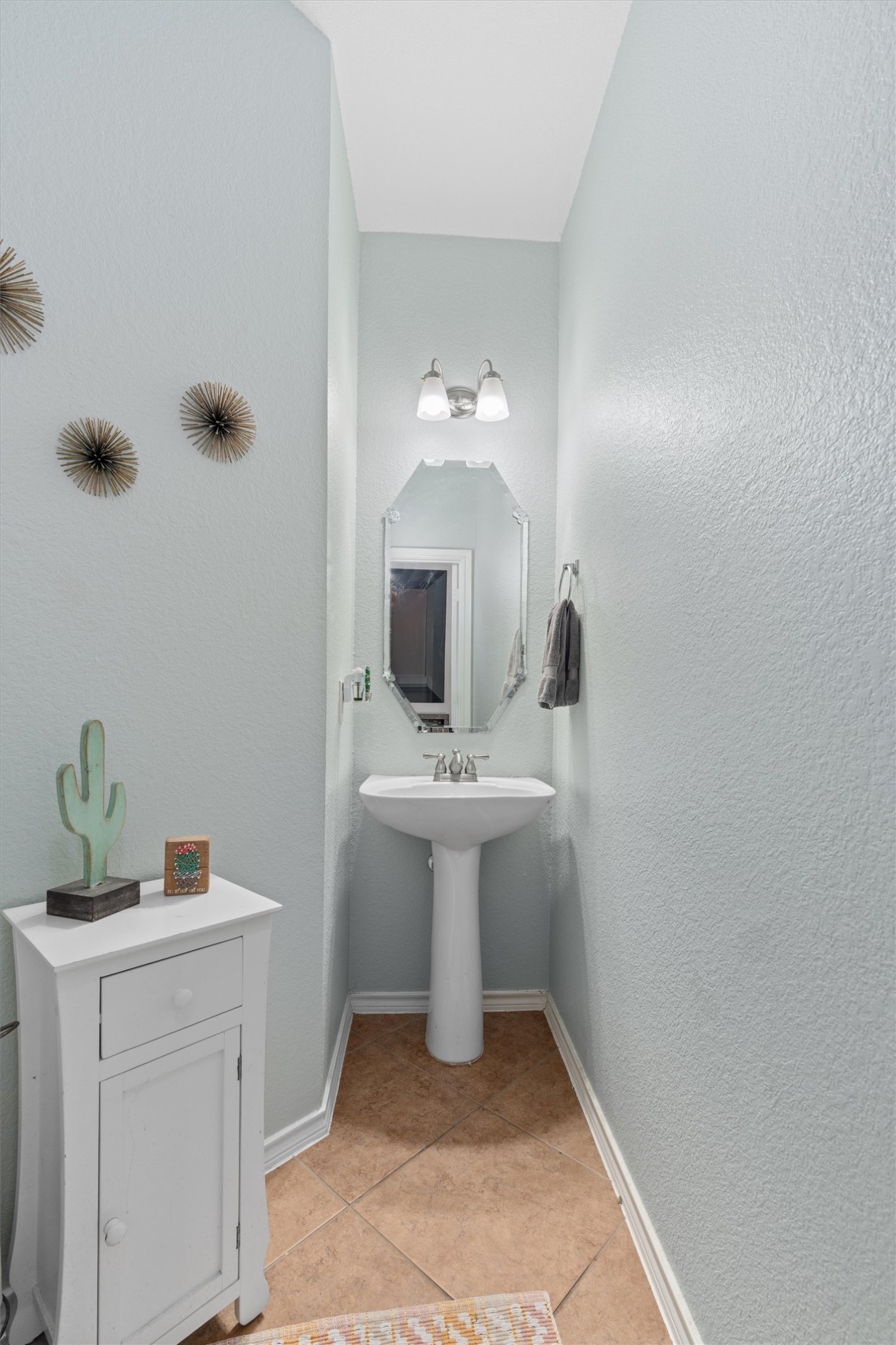400 Red Hawk Drive Leander, TX 78641 - Photo 19 of 36 Half bathroom featuring light tile patterned floors and a textured wall