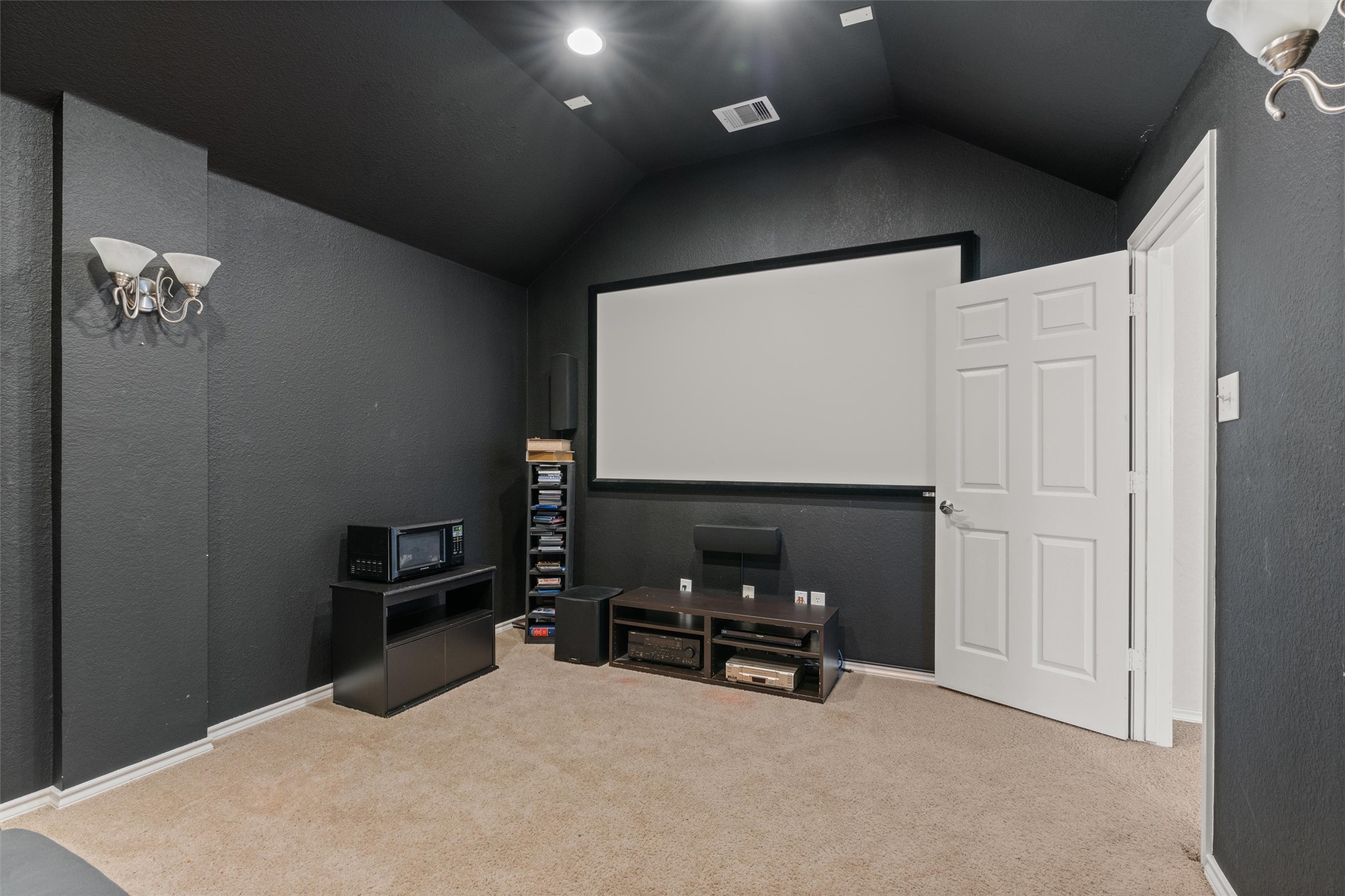 400 Red Hawk Drive Leander, TX 78641 - Photo 23 of 36 Home theater with a textured wall and light colored carpet