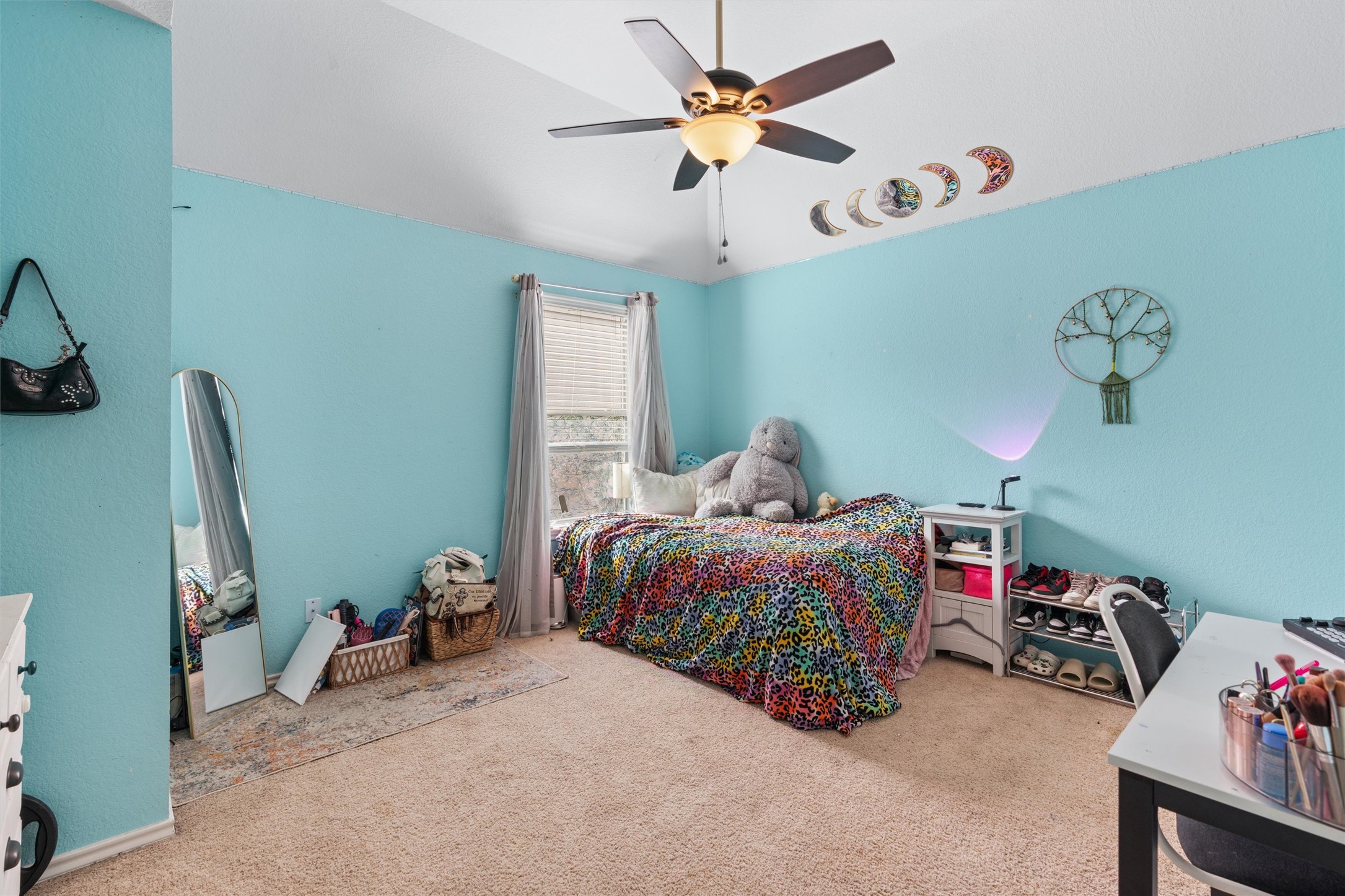 400 Red Hawk Drive Leander, TX 78641 - Photo 25 of 36 Bedroom with light colored carpet, a ceiling fan, and lofted ceiling