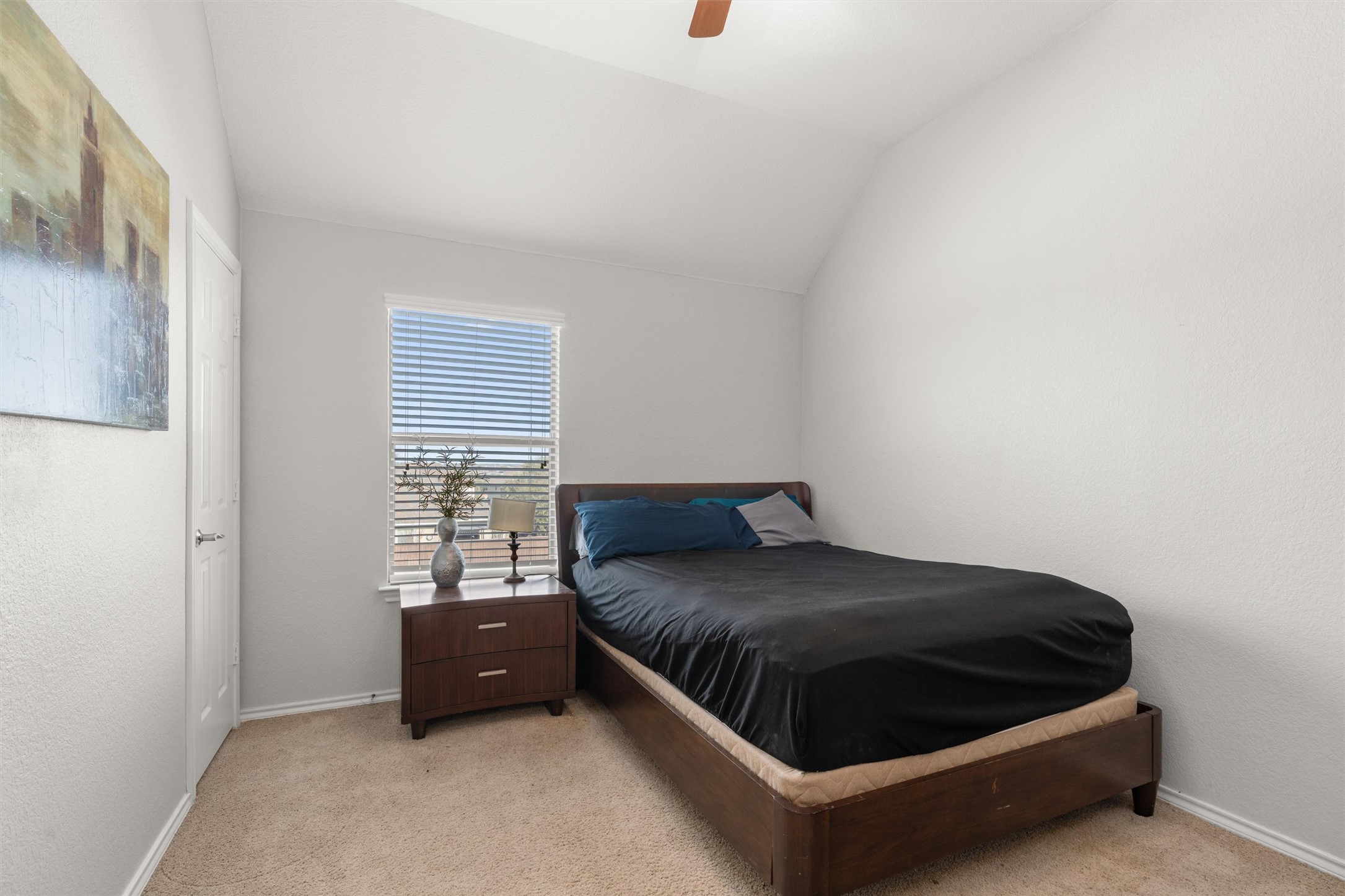 400 Red Hawk Drive Leander, TX 78641 - Photo 26 of 36 Bedroom featuring light carpet, a ceiling fan, and vaulted ceiling