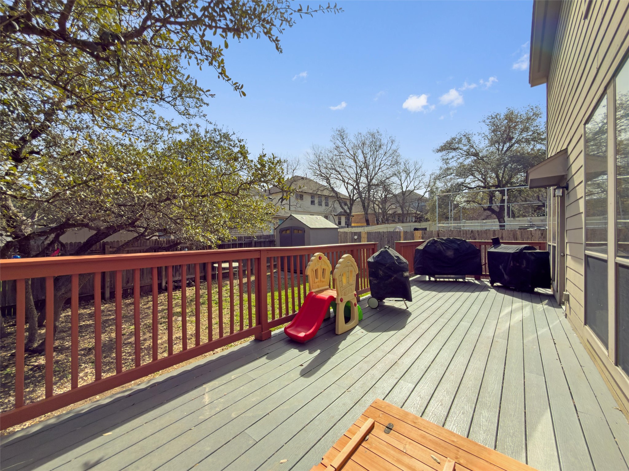 400 Red Hawk Drive Leander, TX 78641 - Photo 28 of 36 Wooden terrace featuring a residential view, a fenced backyard, and area for grilling