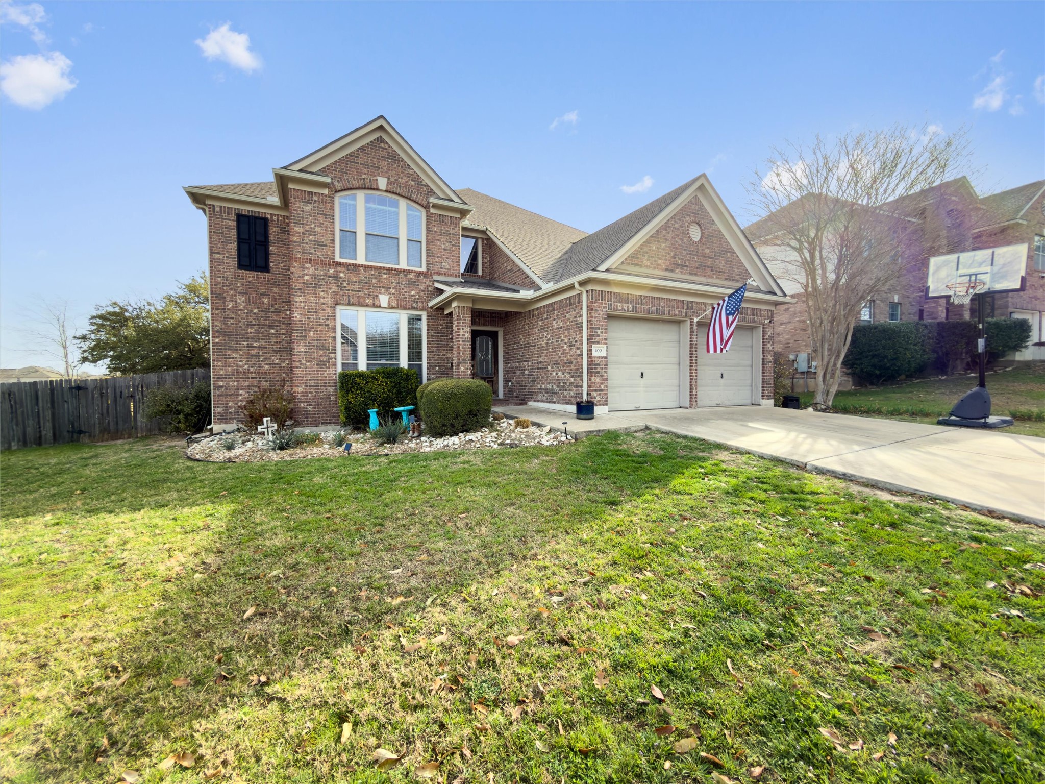 400 Red Hawk Drive Leander, TX 78641 - Photo 2 of 36 Traditional home featuring brick siding, a garage, and concrete driveway