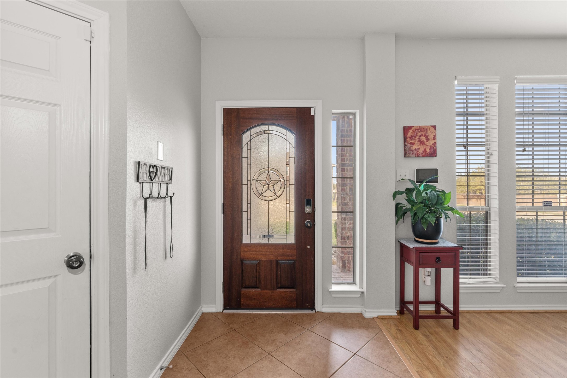 400 Red Hawk Drive Leander, TX 78641 - Photo 3 of 36 Foyer entrance with light tile patterned floors and baseboards