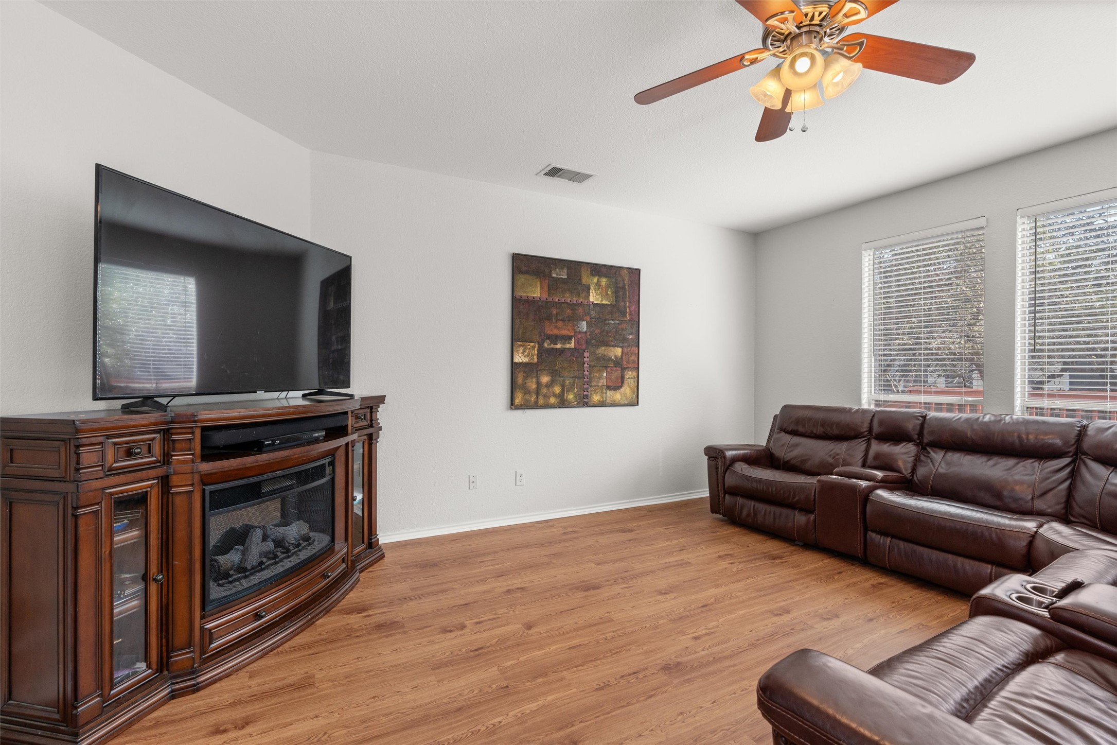 400 Red Hawk Drive Leander, TX 78641 - Photo 6 of 36 Living area with light wood-style floors and ceiling fan