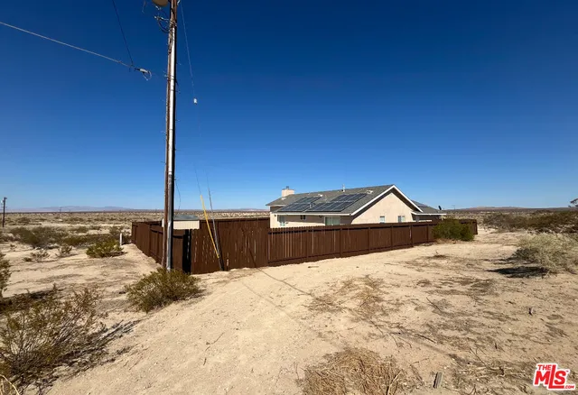 a view of a terrace with wooden fence