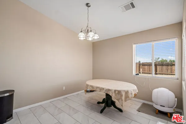 a kitchen with stainless steel appliances granite countertop a stove top oven a refrigerator a sink and dishwasher