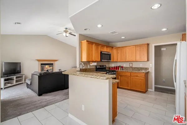 a kitchen with a sink stove and microwave
