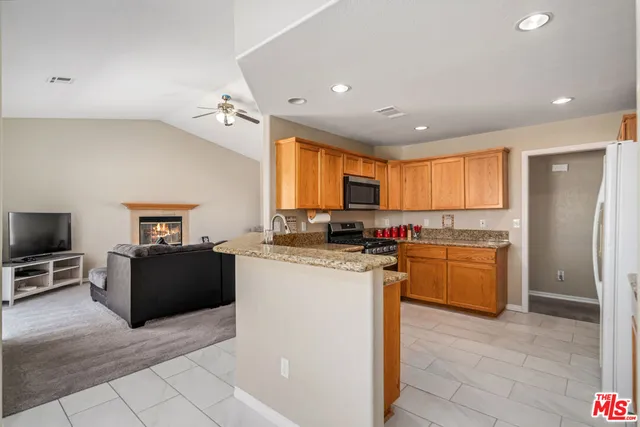 a kitchen with a sink stove and microwave